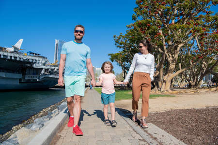 adoption and charity. family day. friendship. father mother and child in park.の写真素材