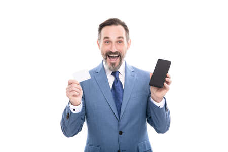 surprised ceo hold card and cell phone for paying online isolated on white copy space, buy online.の写真素材