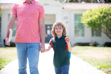 childhood and parenthood. cropped parent leads child boy in first grade.の写真素材