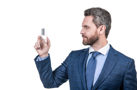 man in businesslike suit presenting product of mens perfume isolated on white, copy space, advert.の写真素材