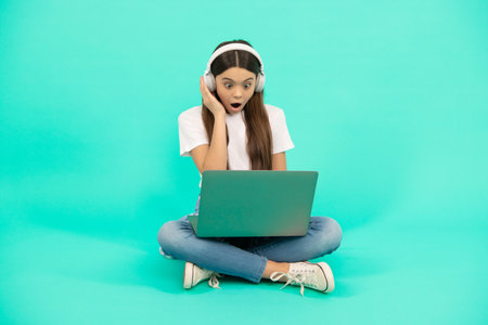 surprised kid chat on computer. buy online. back to school. teen influencer blogging.の写真素材