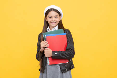 Learning is empowerment. Happy child hold books. School education. Learning and schoolingの写真素材