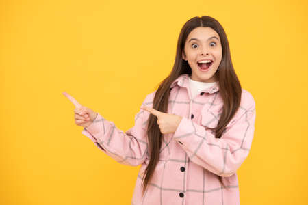 latest trend here. copy space. fashion shopping sale. happy teen girl in checkered shirt.の写真素材