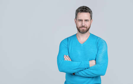 handsome man in casual wear has grizzled hair. successful man on grey background.の写真素材