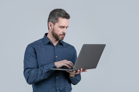 Start quickly. Bearded man work on laptop. E-commerce startup. E-business. Startup companyの写真素材