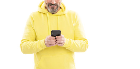 cropped man in hoody chatting on phone online isolated on white copy space, chatの写真素材
