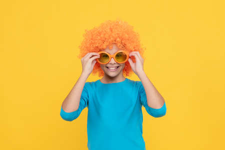how do i look. cheerful teen girl wearing party glasses. just having fun. april fools day.の写真素材