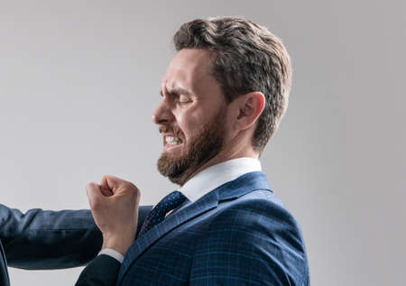 Defending against punch attack. Scared man being punched. Lawyer suffer from workplace aggressionの写真素材