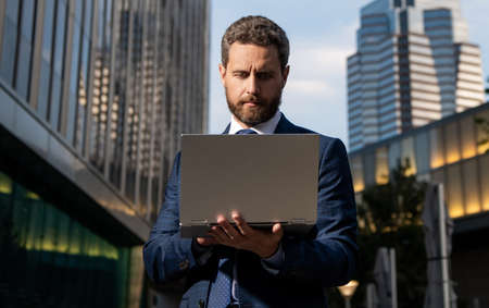 busy businessman working online on laptop outside the office, businessの写真素材