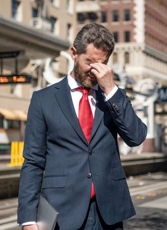 agile business. modern computer communication. portable office outdoor. freelance man hold pcの写真素材