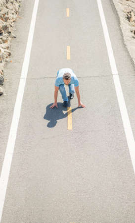 healthy lifestyle. mature man on road start. sport activity. full of energy. guy ready to run.の写真素材