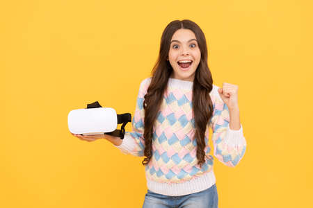 childhood development. amazed teen girl hold wireless VR glasses. using VR headset.