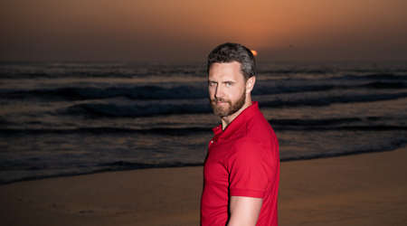 charismativ man portrait over the sea on sunset summer beach, summertimeの写真素材