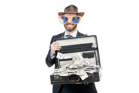 Lucky money. Happy showman hold suitcase with dollars. Investment for money returnの写真素材