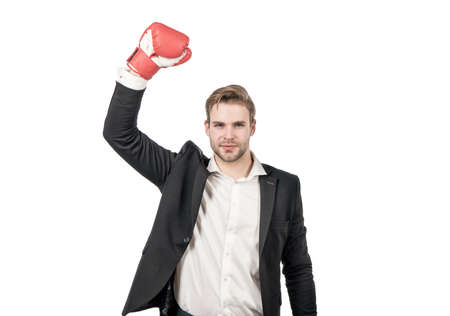 Professional man winner in formal suit with raised boxing glove strength gesture, victoryの写真素材