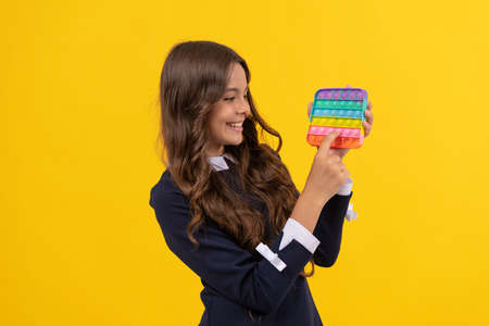 happy child playing with pop it silicone sensory fidget game, popitの写真素材