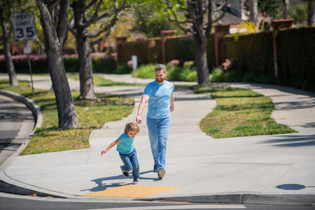 childhood and parenthood. parent relax with small child boy. dad with kid on summerの写真素材