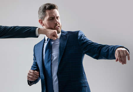 Knockout punch. Professional man got punch in chin. Physical fight. Fighting and conflictingの写真素材