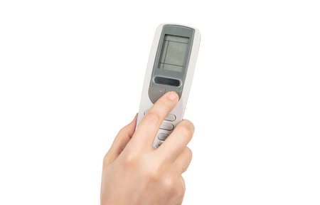 hand pressing button on remote control isolated on white background. under control.