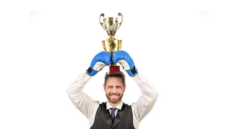happy guy in boxing gloves and formalwear hold champion cup isolated on white background, victoryの写真素材