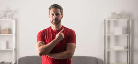 handsome mature guy with beard pointing finger. portrait of bearded man point fingerの写真素材