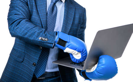 cropped businessman man in suit and boxing gloves holding laptop isolated on white, cyber bullingの写真素材