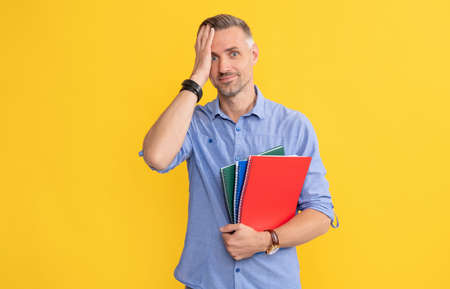 amazed man hold school notebook or planner, university