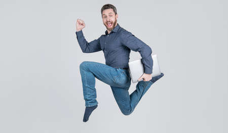 entrepreneur running and hurrying. agile business. network administrator hold computer.の写真素材