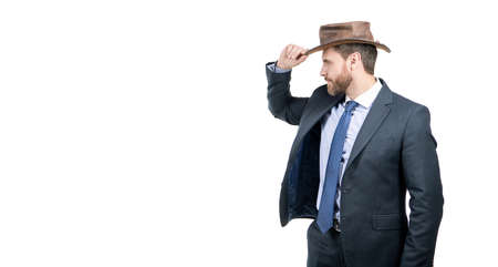 Serious professional man in formal suit fix cowboy hat isolated on white copy space, businessmanの写真素材