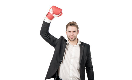 Professional man winner in formal suit with raised boxing glove strength gesture isolated on white,...