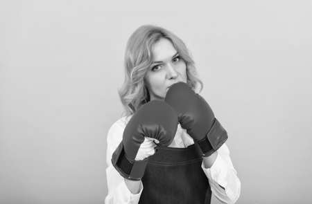 she will fight. housework and household. aggressive female barista punching. professional cook bossの写真素材