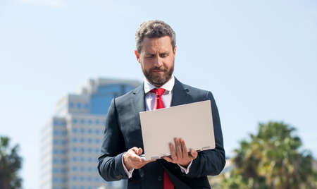 busy businessman using laptop for blogging. social network and weblog.