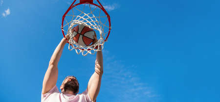 guy has sport motivation. sport and hobby. dunk in basket. slam dunk in motion.の写真素材
