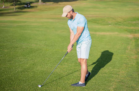 concentrated man playing game on green grass. summer activity. professional sport outdoor.の写真素材