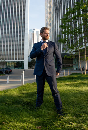 entrepreneur outside the office. male formal fashion. professional unshaven ceo. full length.の写真素材