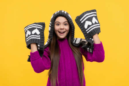 amazed teen girl wear knitted hat, winterの写真素材