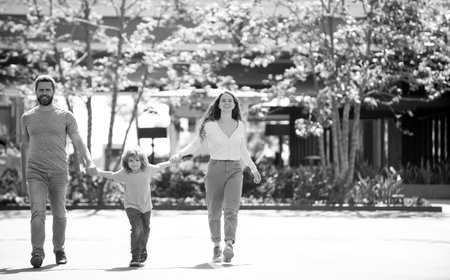 father mother and child in summer. friendly family. family weekend. happy parents with kid boyの写真素材