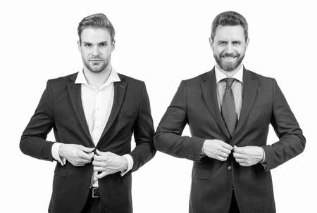 buttoning jacket. businessmen isolated on white. boss and employee. confident business partners.