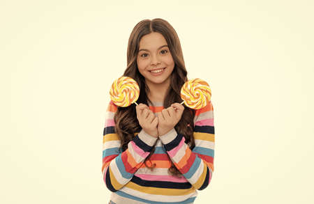 happy child in colorful sweater with lollipop candy on stick isolated on white background, childhoodの写真素材