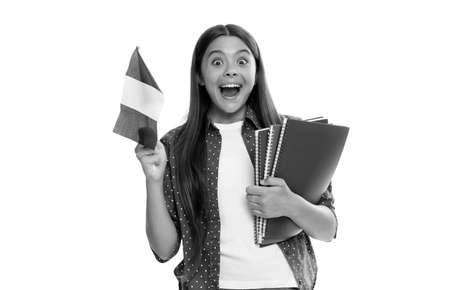 amazed kid hold french flag and school copybook for studying isolated on white, study abroad