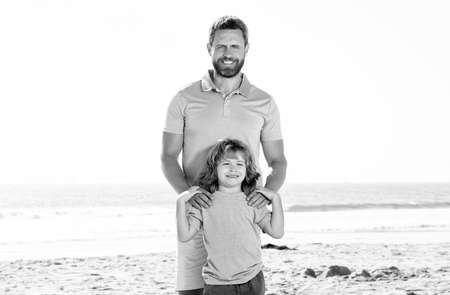 family travel weekend and vacation. childhood and parenting. daddy with kid boy in seaの写真素材