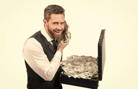 investment. happy businessperson with money case. investor hold case with dollars cashの写真素材