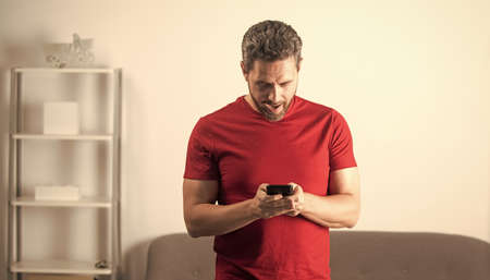 amazed man chat online. blogging concept. modern communication technology.の写真素材