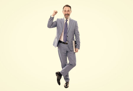 professional network administrator hold computer. happy boss with modern wireless laptopの写真素材