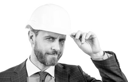 successful man with greeting gesture. entrepreneur in protective helmet. chief architect engineer
