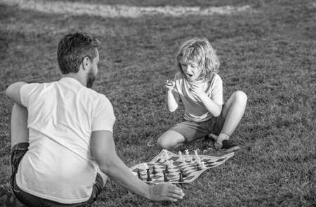 fathers day. happy family. parenthood and childhood. checkmate. spending time together.の写真素材