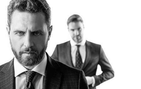 Serious male face. Serious businessman isolated on white. Professional man with unshaven faceの写真素材