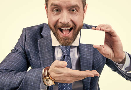 just look over there. businessman presenting credit or debit card. happy ceoの写真素材