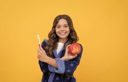 strong teeth. childrens healthy beautiful smile. cheerful teenage girl brush teeth.の写真素材