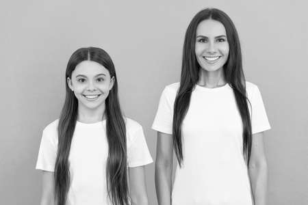 mother and daughter kid in white shirt. happy childhood and motherhood. concept of friendship.